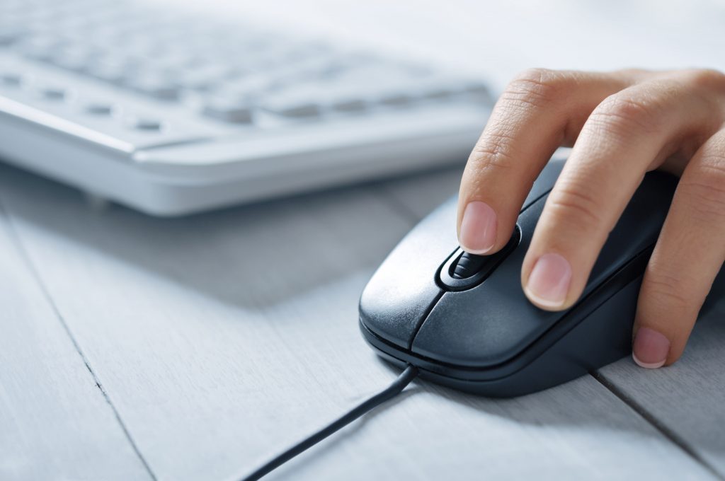 Woman holding a computer mouse